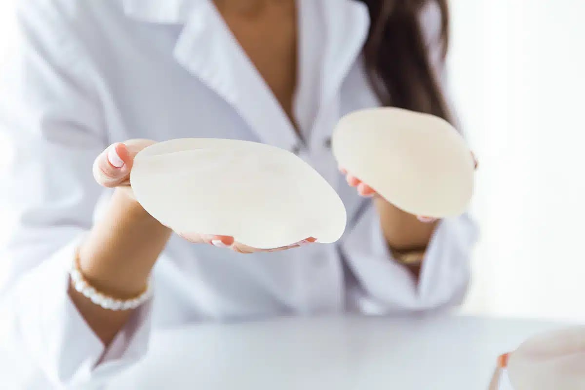 Female doctor choosing mammary prosthesis in the office Female doctor choosing mammary prosthesis in the office