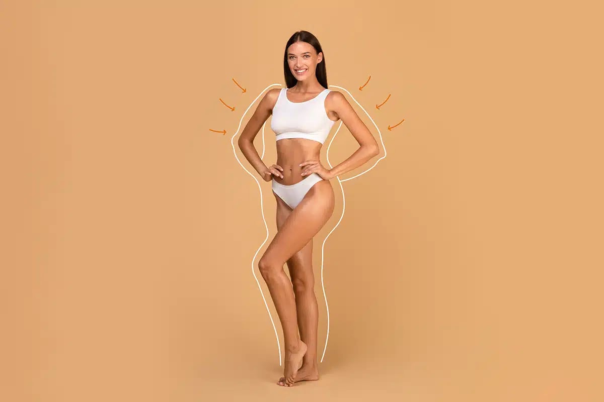 Female model in white top bra and panties posing on beige studio background
