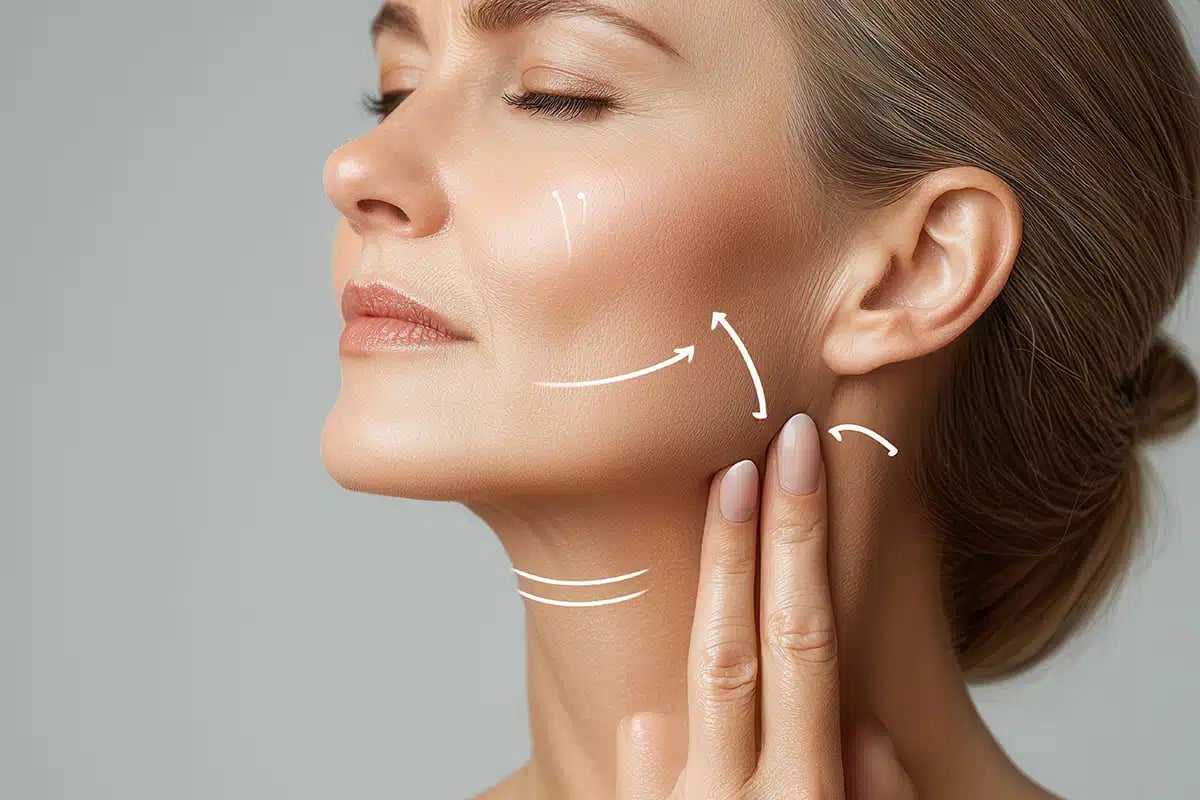 Middle-aged woman practicing skincare routine with focus on neck and jawline for anti-aging and healthy skin