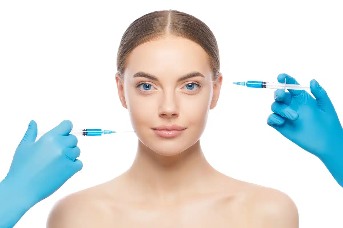 Portrait of young woman ready for face injection by beauty doctors