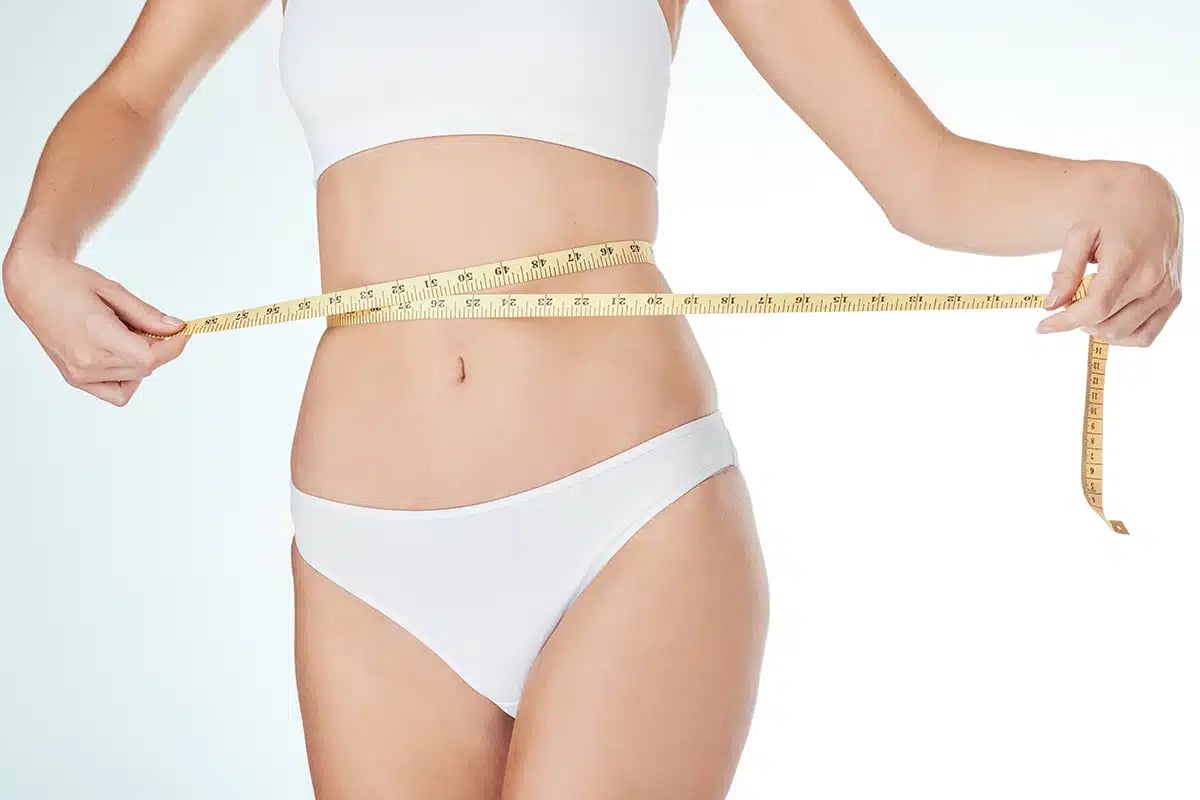 Woman, underwear and tape measure for weight loss, fitness and healthy diet